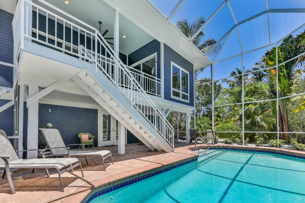 an exterior view of a house with a swimming pool at SECRET HARBOR in Sanibel