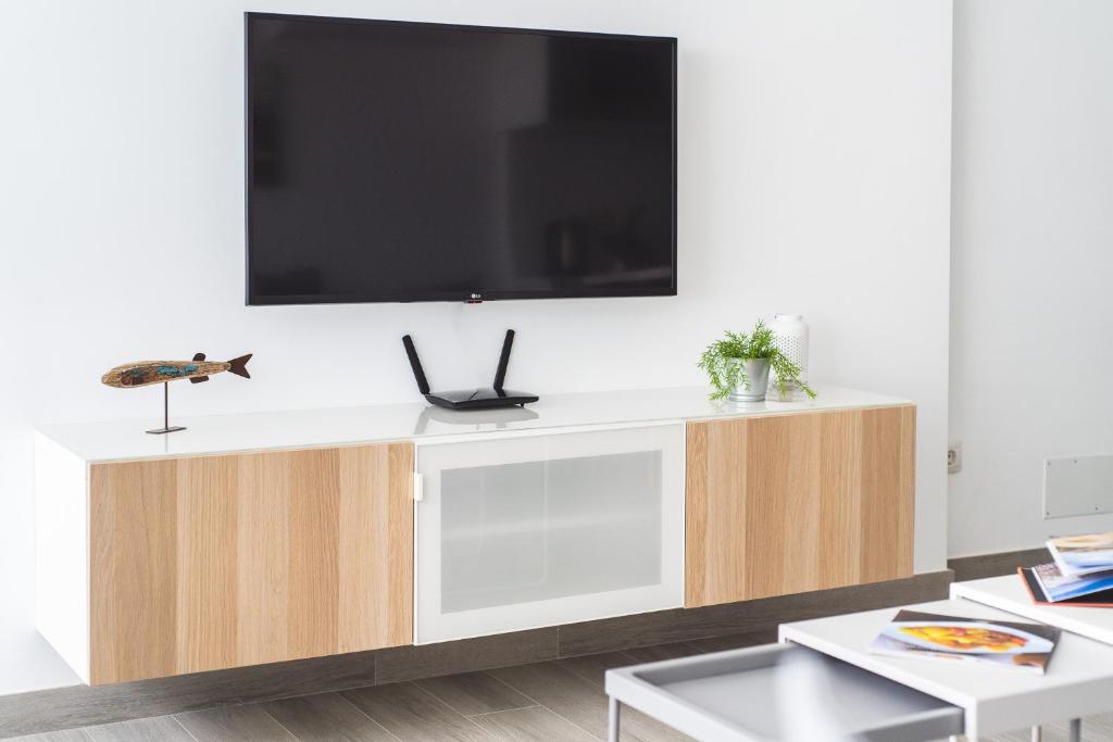 Televízia a/alebo spoločenská miestnosť v ubytovaní Home2Book Sunny Beach Maspalomas Playa del Inglés