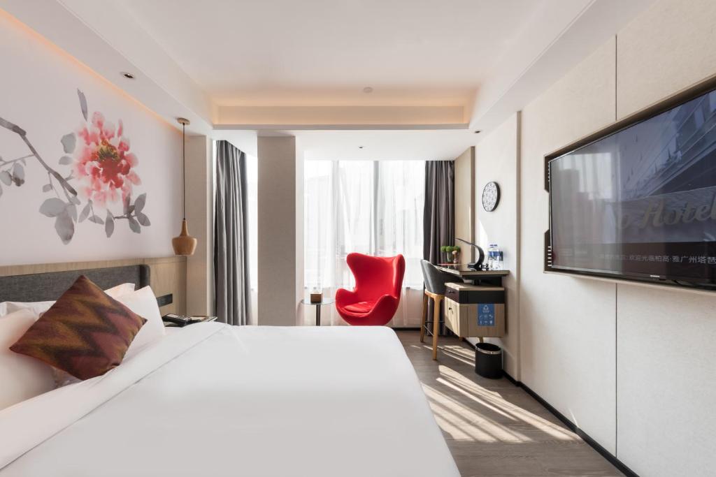 TV a/nebo společenská místnost v ubytování Paco Hotel Canton Tower Pazhou