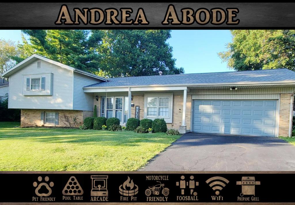 una casa con un garaje y un cartel delante en Andrea Abode home, en Lexington
