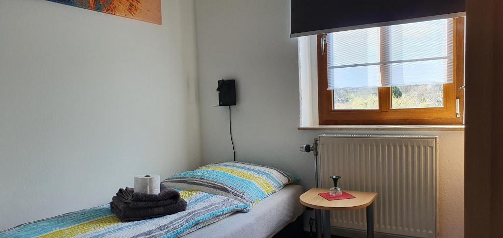 Postel nebo postele na pokoji v ubytování Alte Post zu Stetzsch