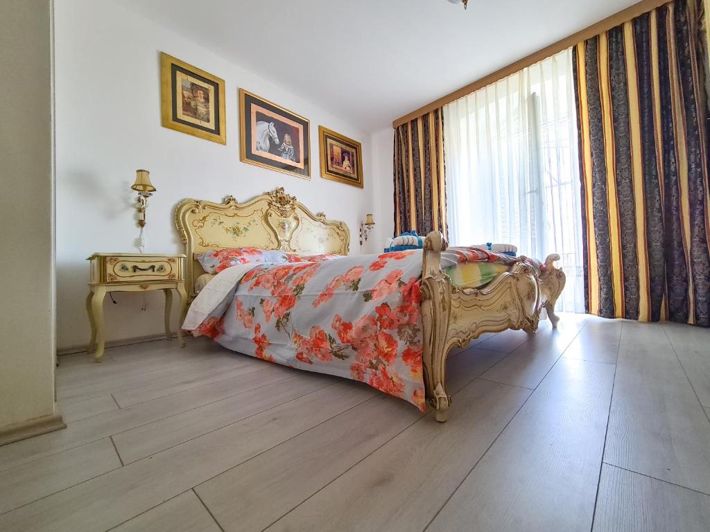 a bedroom with a bed and a table and a window at Kaya house in Nerežišća