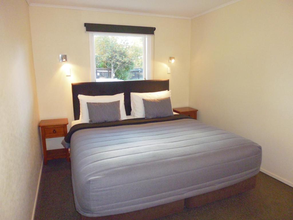 Postel nebo postele na pokoji v ubytování Spa Lodge Motel