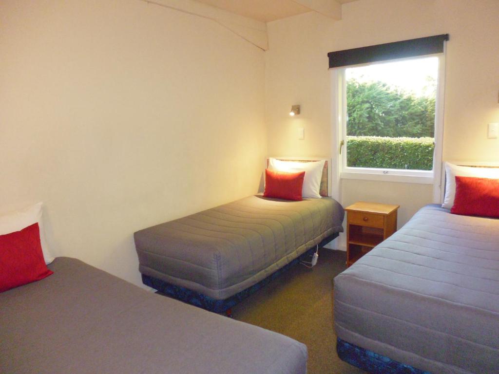 Postel nebo postele na pokoji v ubytování Spa Lodge Motel