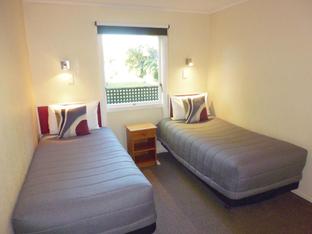 Postel nebo postele na pokoji v ubytování Spa Lodge Motel