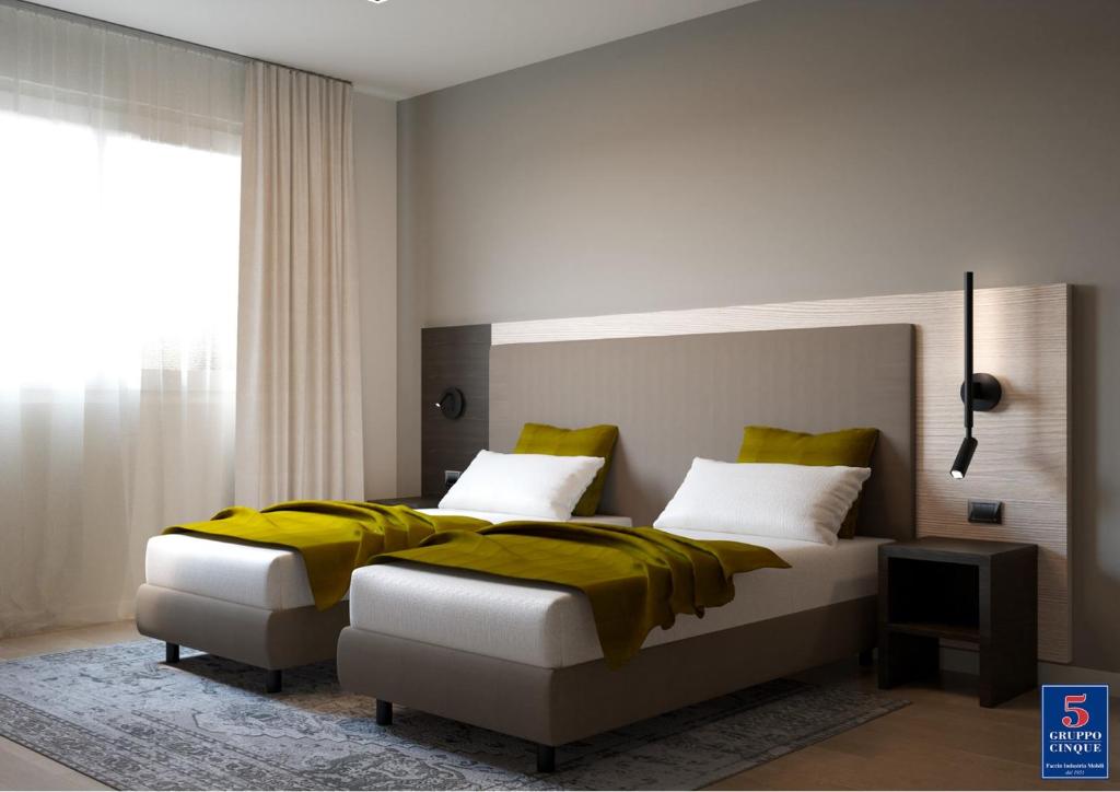 Postel nebo postele na pokoji v ubytování Threeland Hotel