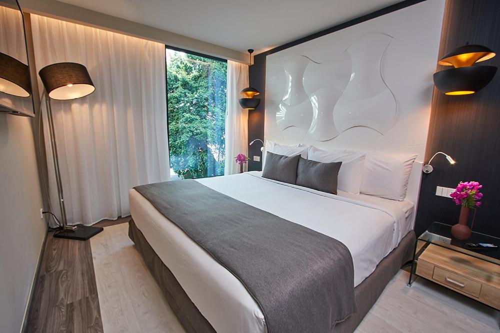 Tempat tidur dalam kamar di Gran Evenia Panamá Hotel