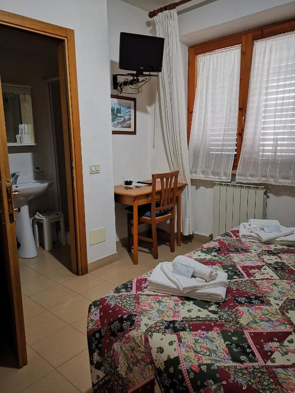 Postel nebo postele na pokoji v ubytování Osteria dei Locandieri