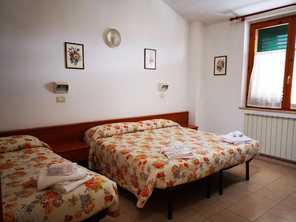 Postel nebo postele na pokoji v ubytování Osteria dei Locandieri