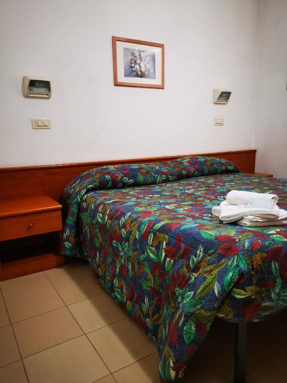 Postel nebo postele na pokoji v ubytování Osteria dei Locandieri
