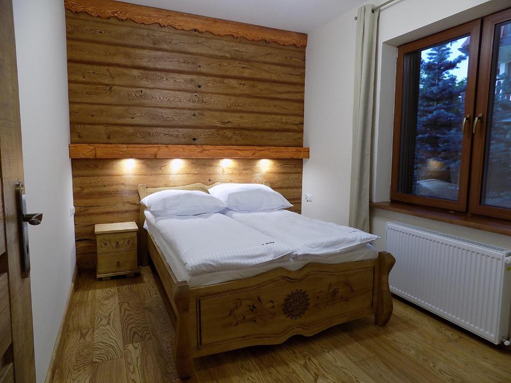 Posteľ alebo postele v izbe v ubytovaní Apartament nr 4 U Miśka z dwoma sypialniami