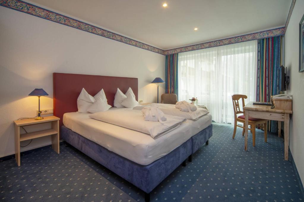 Postel nebo postele na pokoji v ubytování Aktiv Hotel Schweiger