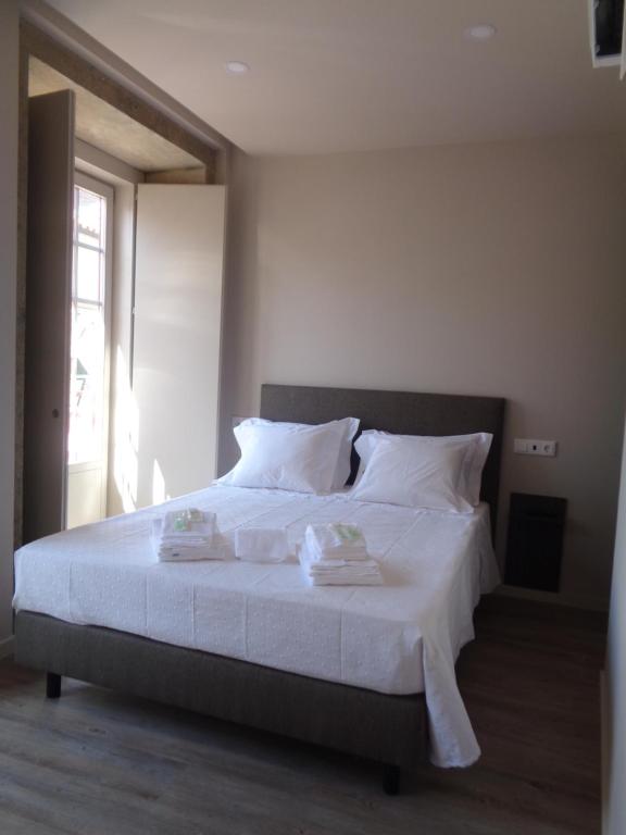 Postel nebo postele na pokoji v ubytování Rua Grande Hotel