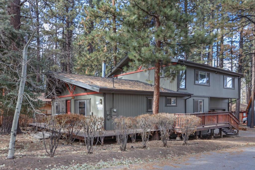 a house in the woods with trees at La Cerena Getaway #1960 by Big Bear Vacations in Big Bear Lake