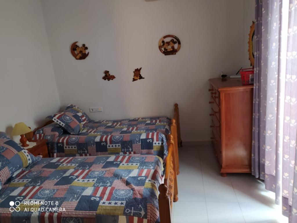Posteľ alebo postele v izbe v ubytovaní ALQUILER CHIPIONA