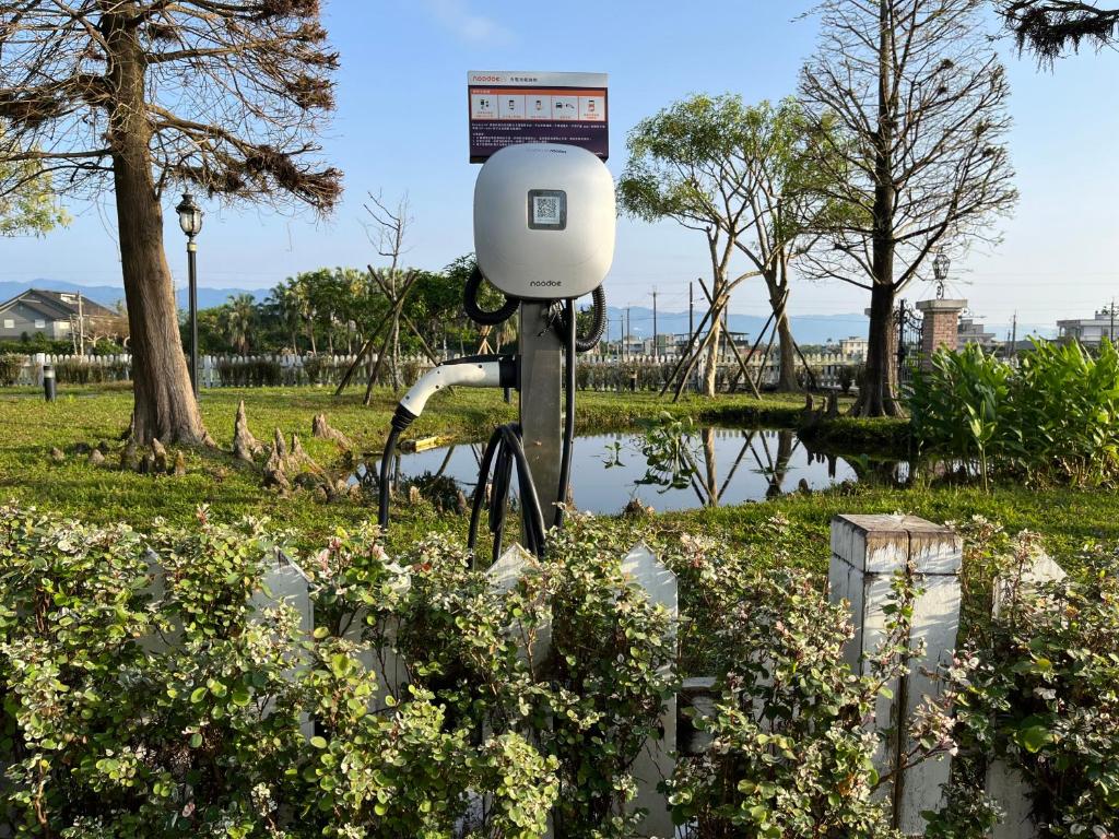 a camera in a park next to a body of water at Sunday Home in Dayin