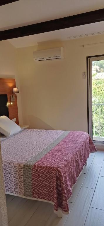 Postel nebo postele na pokoji v ubytování Brit Hotel Confort Hélios Agde