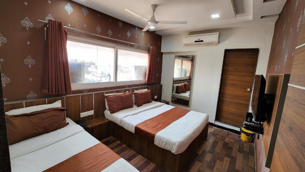 Postel nebo postele na pokoji v ubytování Hotel Nova Prime