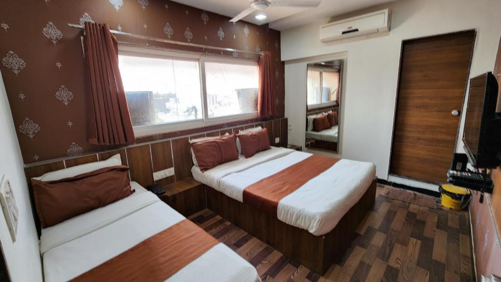 Postel nebo postele na pokoji v ubytování Hotel Nova Prime