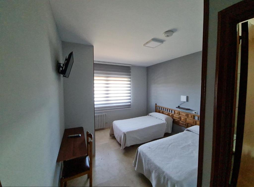 Un pat sau paturi într-o cameră la Hospedaxe Don Manuel
