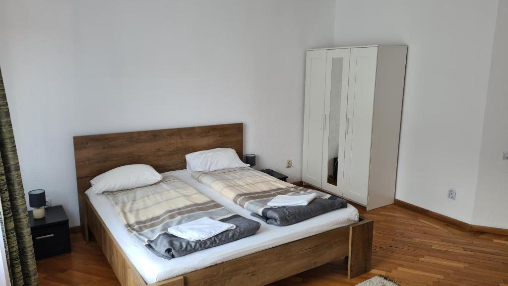 Postel nebo postele na pokoji v ubytování BigCitty Rooms