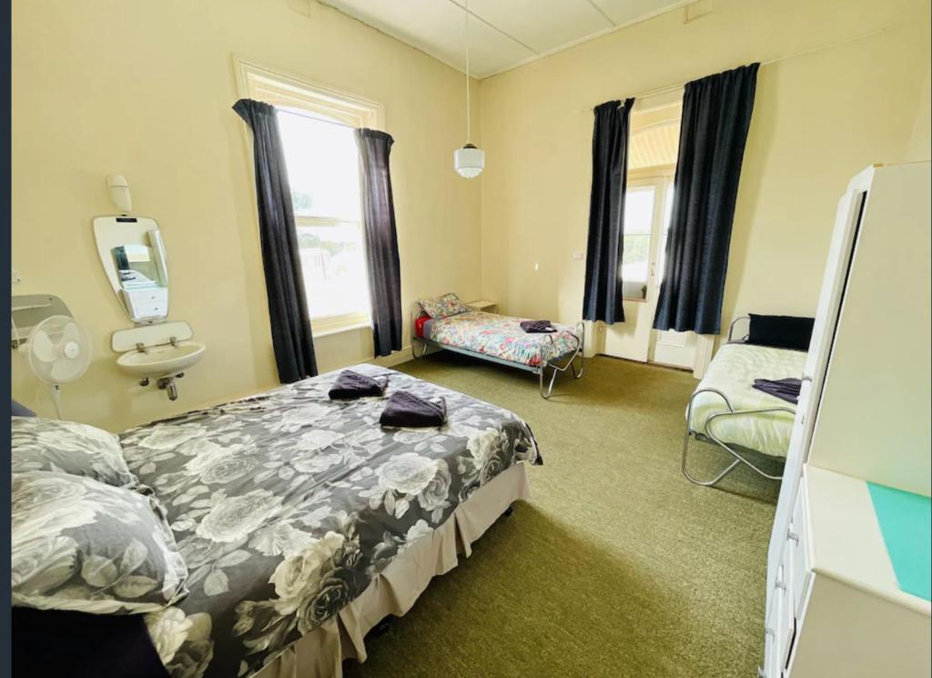 a hospital room with a bed and a chair at Wilmington Hotel in Wilmington