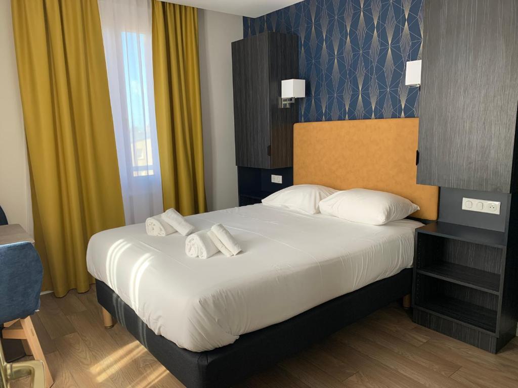 Кровать или кровати в номере Hotel Le Cosy Riva Bella