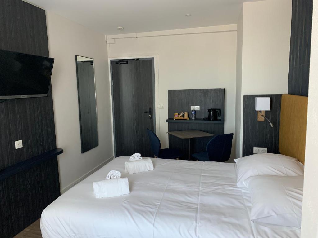 Кровать или кровати в номере Hotel Le Cosy Riva Bella