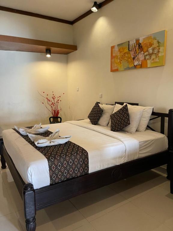 Postel nebo postele na pokoji v ubytování Bali Ayu Hotel & Villas
