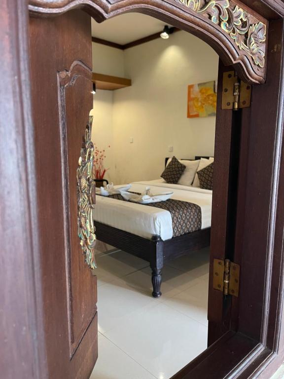 Postel nebo postele na pokoji v ubytování Bali Ayu Hotel & Villas