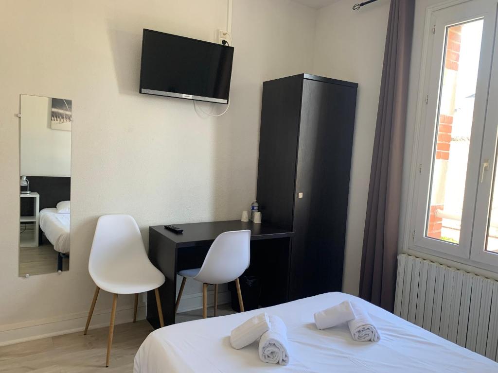 Кровать или кровати в номере Hotel Le Cosy Riva Bella