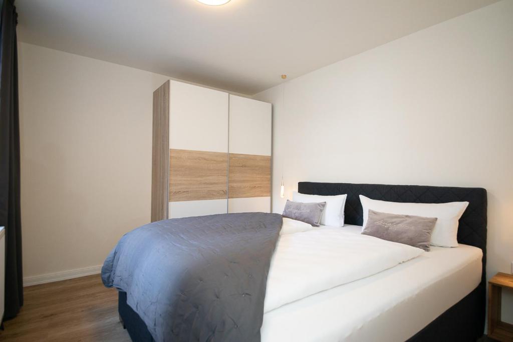 Postel nebo postele na pokoji v ubytování Marin Hotel Sylt GmbH