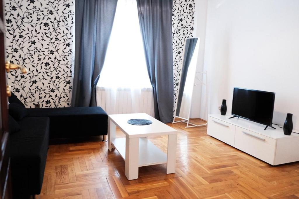 TV a/nebo společenská místnost v ubytování Red Clay Apartments City Club