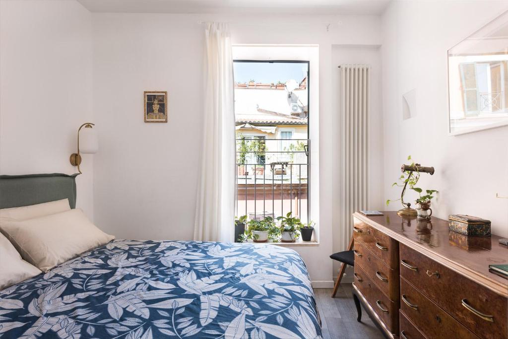 Postel nebo postele na pokoji v ubytování Idyllia lighty flat with views in Trastevere