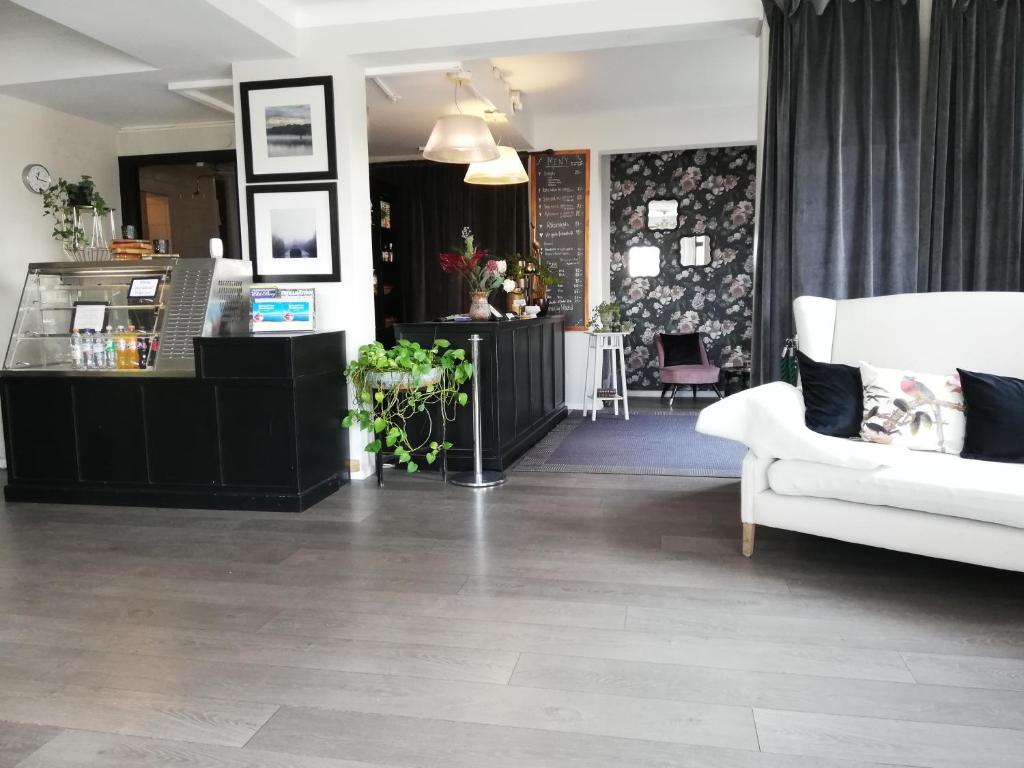 Kuchyň nebo kuchyňský kout v ubytování Strand Hotell