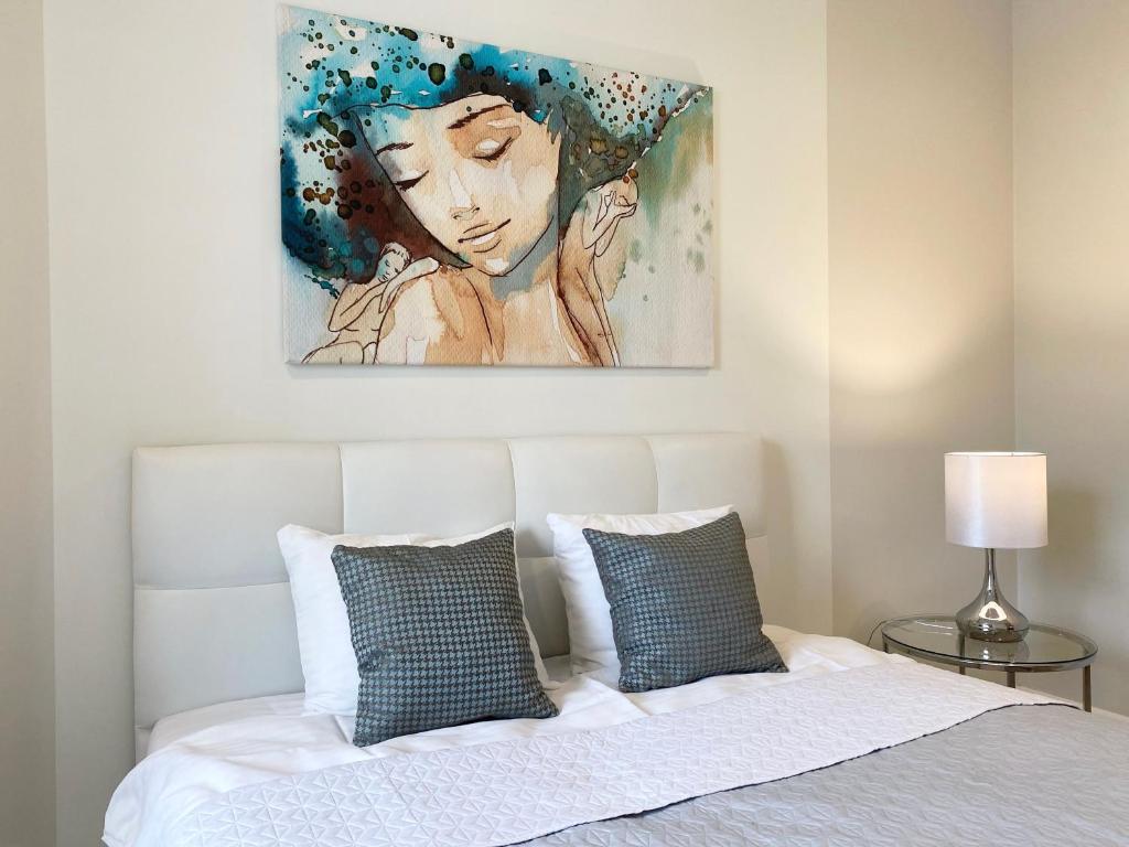 Ένα ή περισσότερα κρεβάτια σε δωμάτιο στο Ultra Apartments Nautica