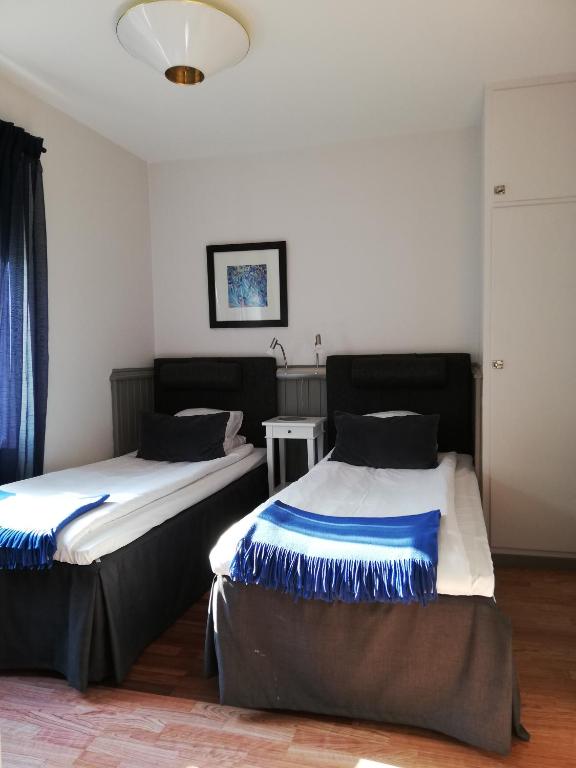 Postel nebo postele na pokoji v ubytování Strand Hotell