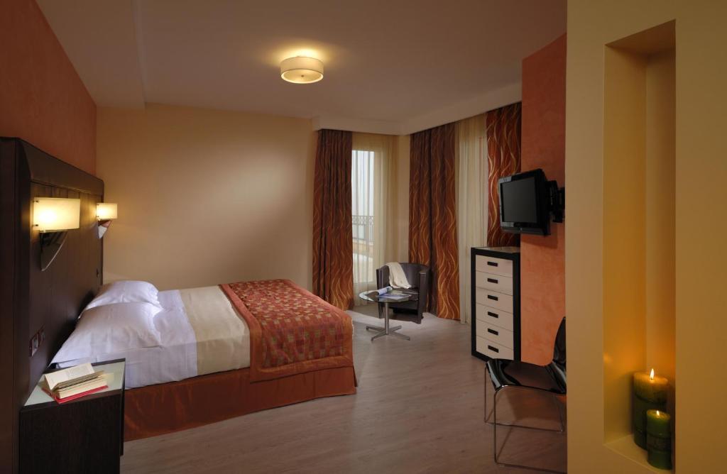 Posteľ alebo postele v izbe v ubytovaní Hotel La Cartiera