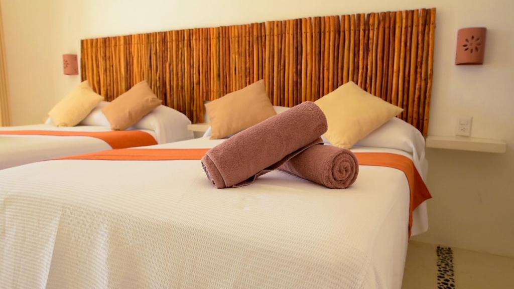 Postel nebo postele na pokoji v ubytování Mis Sueños Holbox