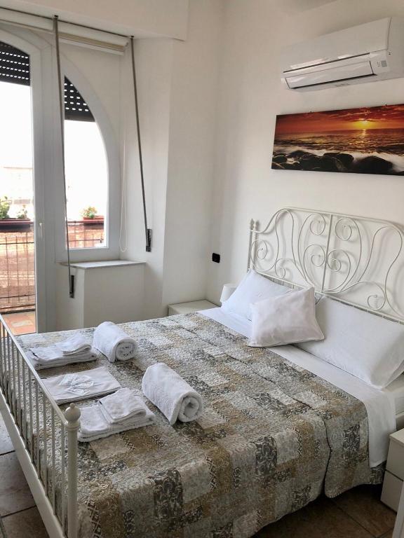 Postel nebo postele na pokoji v ubytování B&B Il Poeta sul Mare