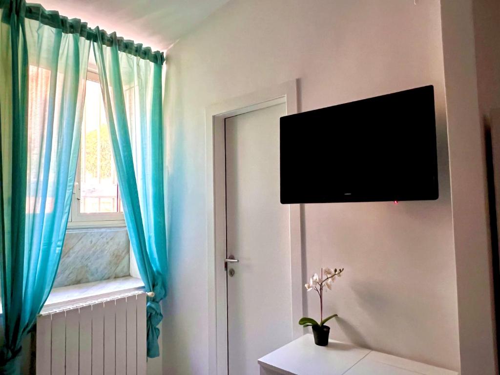 TV a/nebo společenská místnost v ubytování Hotel Pisa