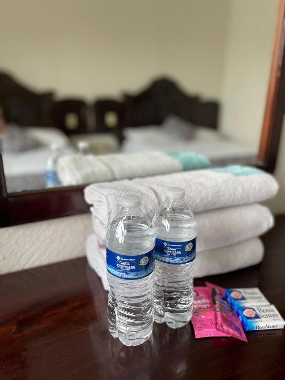 Postel nebo postele na pokoji v ubytování Hotel California