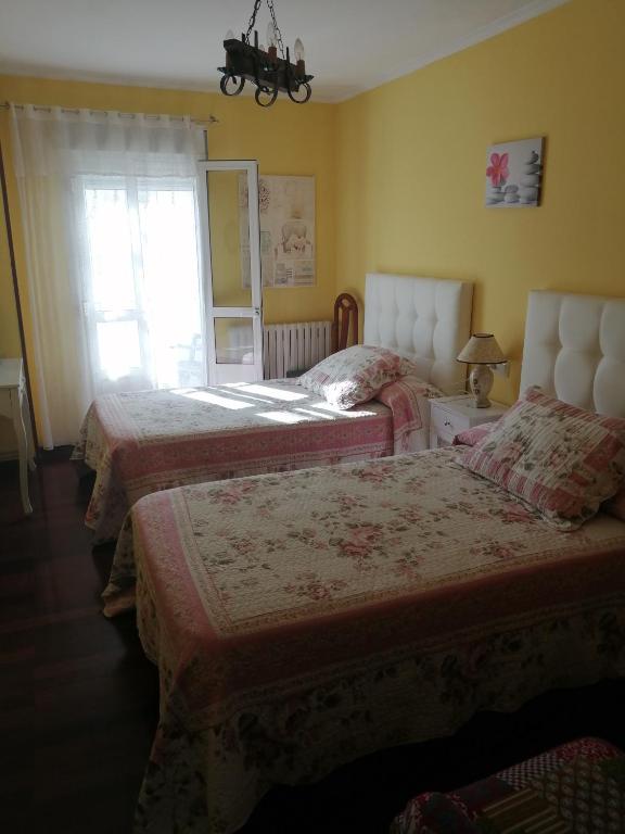 Posteľ alebo postele v izbe v ubytovaní Pensión Casa Frade