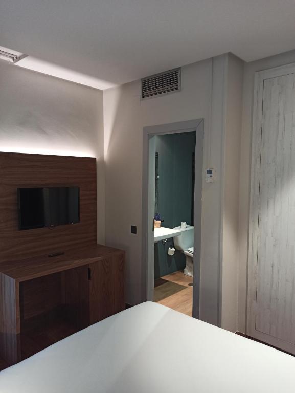 Postel nebo postele na pokoji v ubytování ARVA Spa París