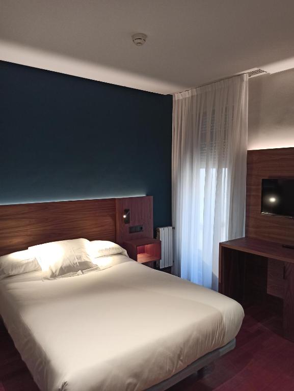 Postel nebo postele na pokoji v ubytování ARVA Spa París