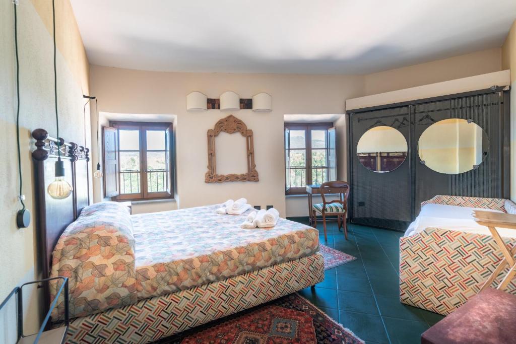 Postel nebo postele na pokoji v ubytování Hotel Della Fortezza