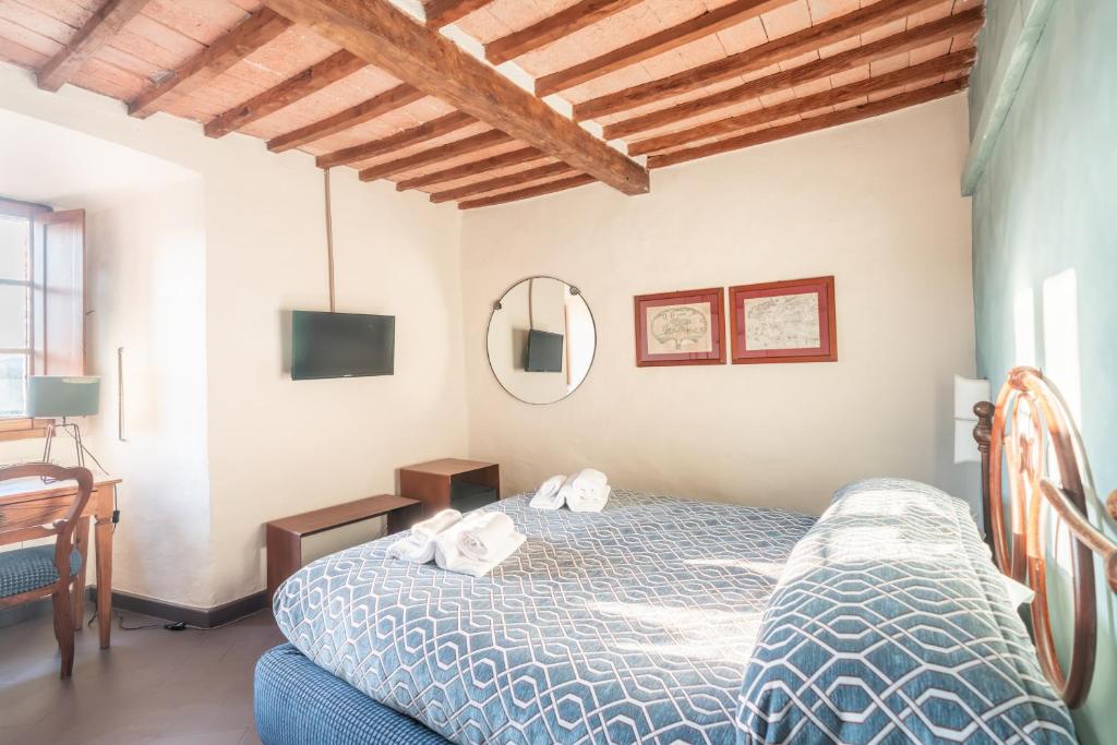 Postel nebo postele na pokoji v ubytování Hotel Della Fortezza