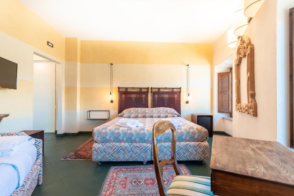 Postel nebo postele na pokoji v ubytování Hotel Della Fortezza