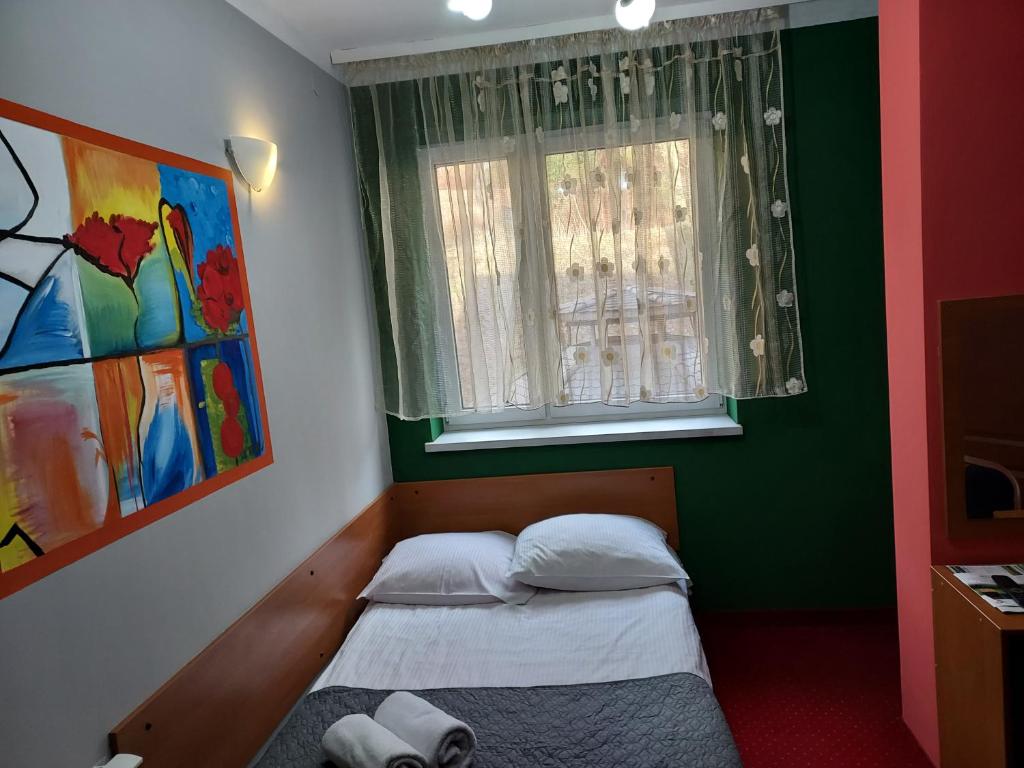 Postel nebo postele na pokoji v ubytování Rezydencja Izabella