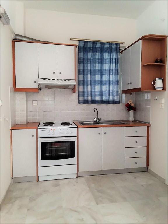 Kuchyň nebo kuchyňský kout v ubytování Areti & Maria Apartments